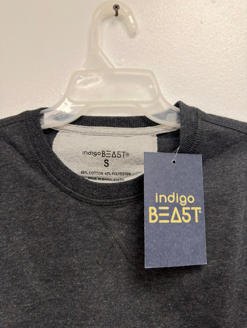 Indigo Beast charcoal heather top, neck label (Made in Bangladesh) and hang tag