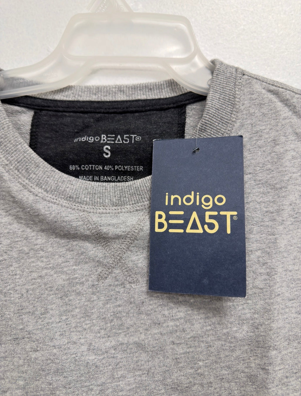 Indigo Beast grey heather top, neck label (60% cotton 40% polyester, Made in Bangladesh) and hang tag