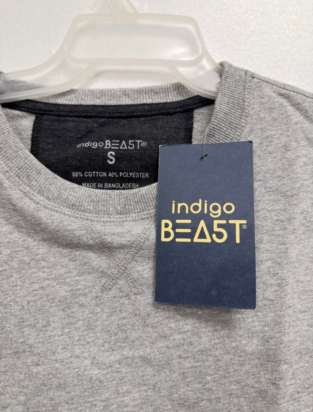Indigo Beast grey heather top, neck label (60% cotton 40% polyester, Made in Bangladesh) and hang tag