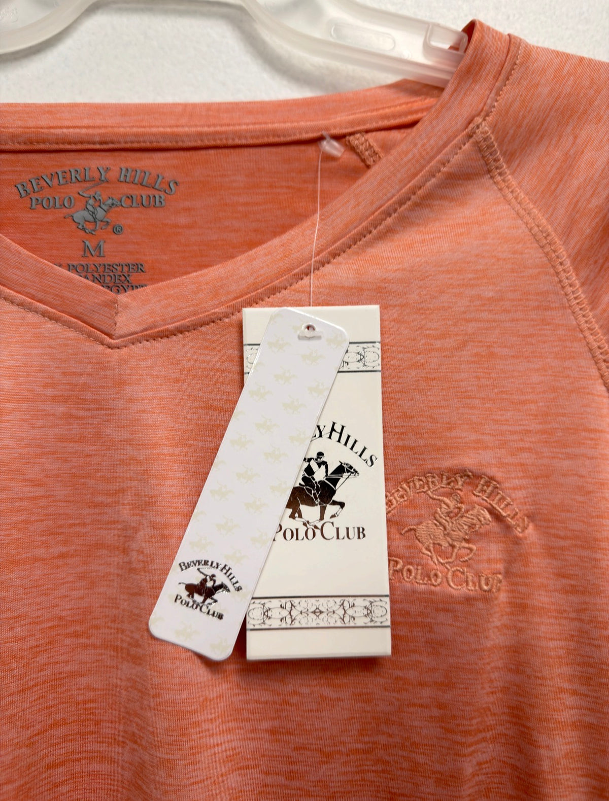 Beverly Hills Polo Club orange top, neckline and hang tag