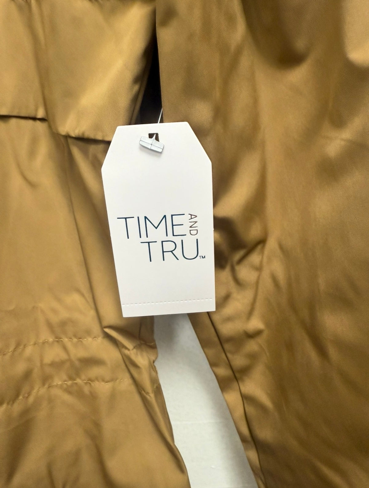 Time and Tru hang tag on brown rain jacket